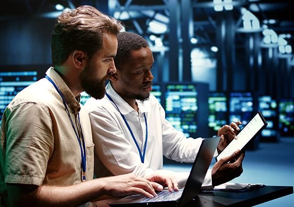 Two guys working in a server room