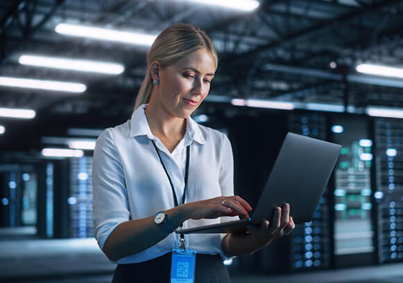 Woman looking at her laptop in the office
