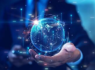 Hand holding a globe with numbers and lines going virtually out of the globe