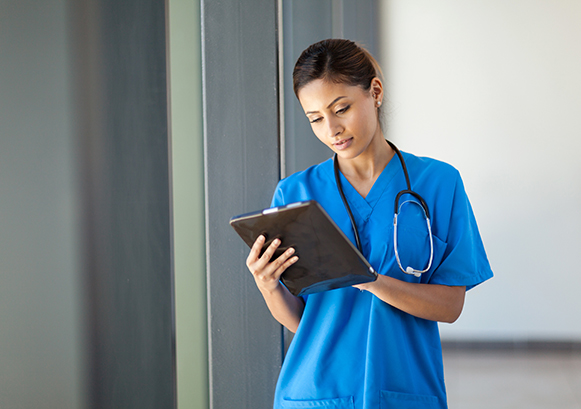 Nurse watching a device