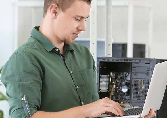 Man looking at his laptop