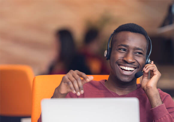 A guy smiling while on the phone