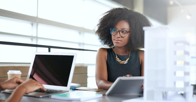 women sitting at a desk