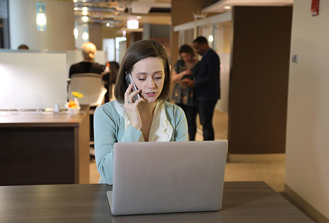 Woman on the phone talking inside