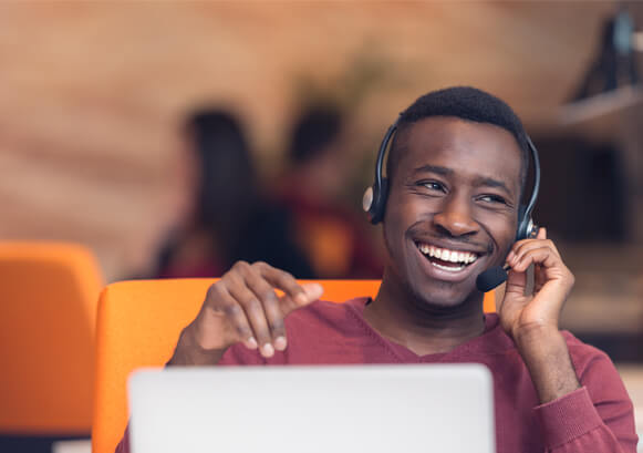 A guy smiling on the phone